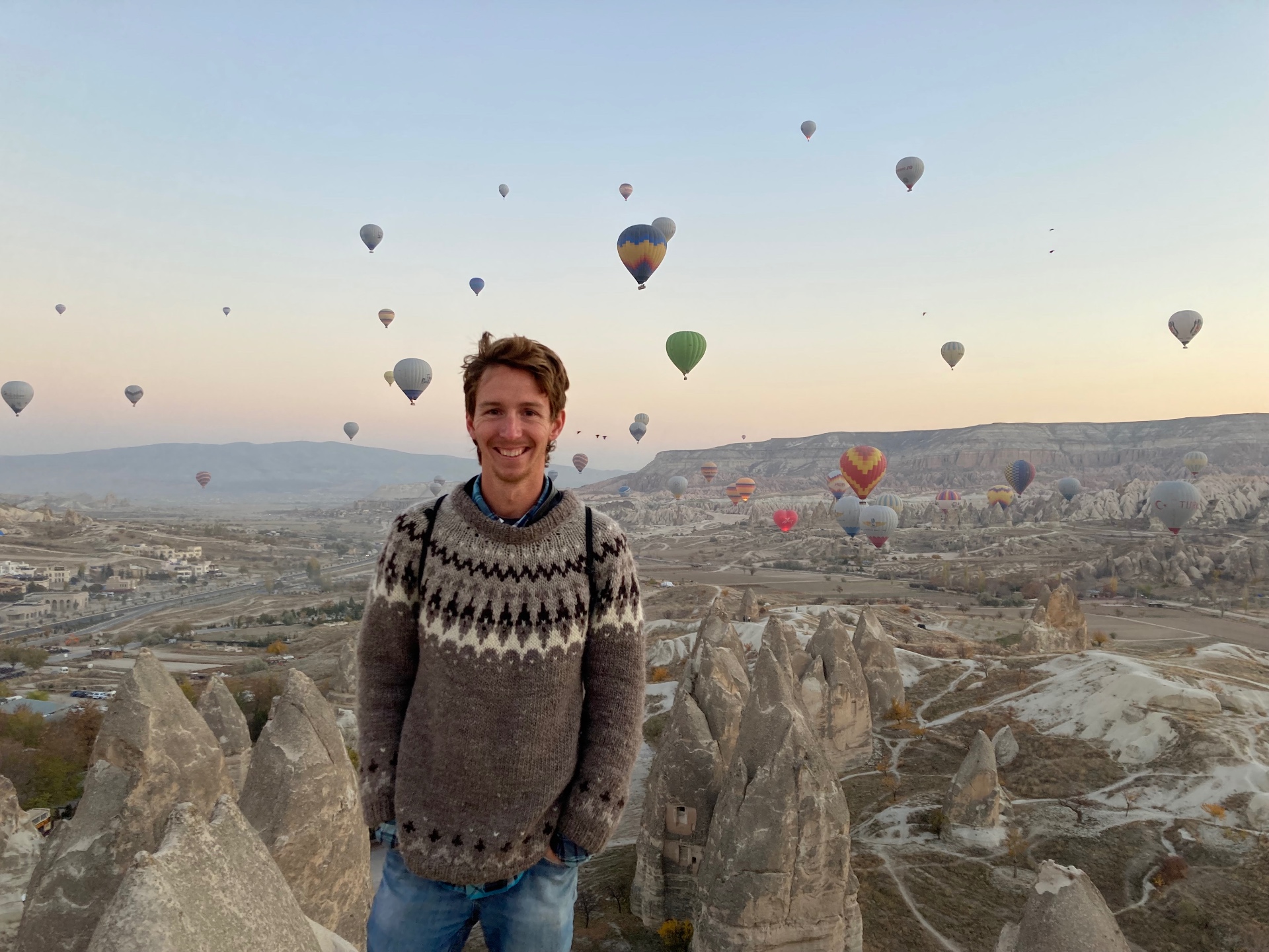 Mike in Cappadocia with hot air balloons at sunrise